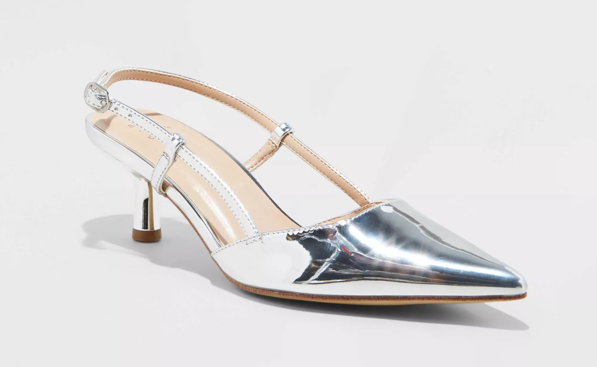 The pointed toe, slingback shoes in reflective silver