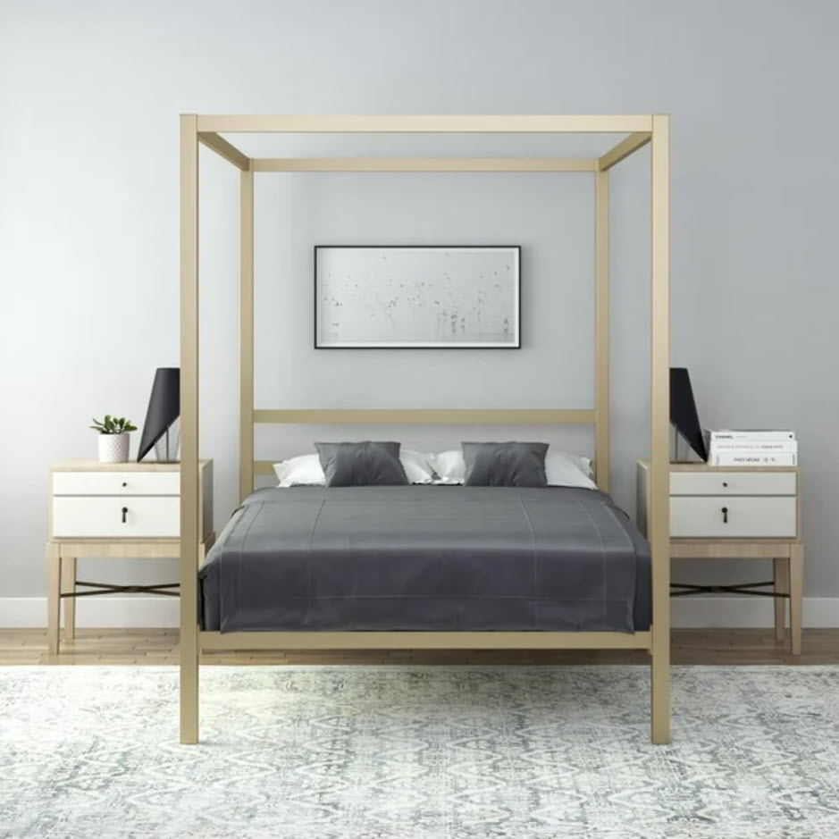 gold canopy bedframe in bedroom