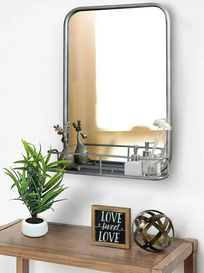 silver wall mirror with small shelf