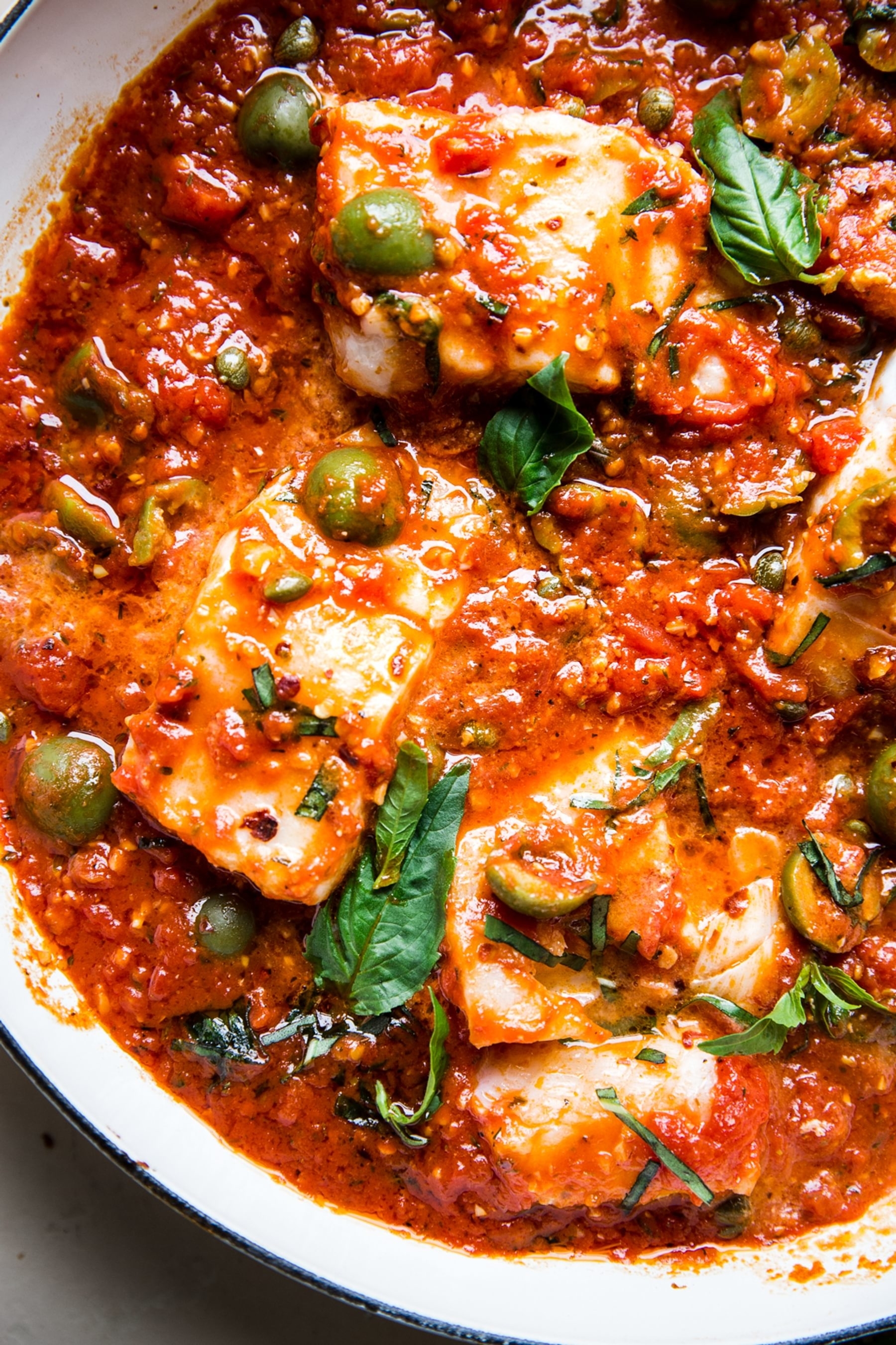 White fish in tomato sauce with olives