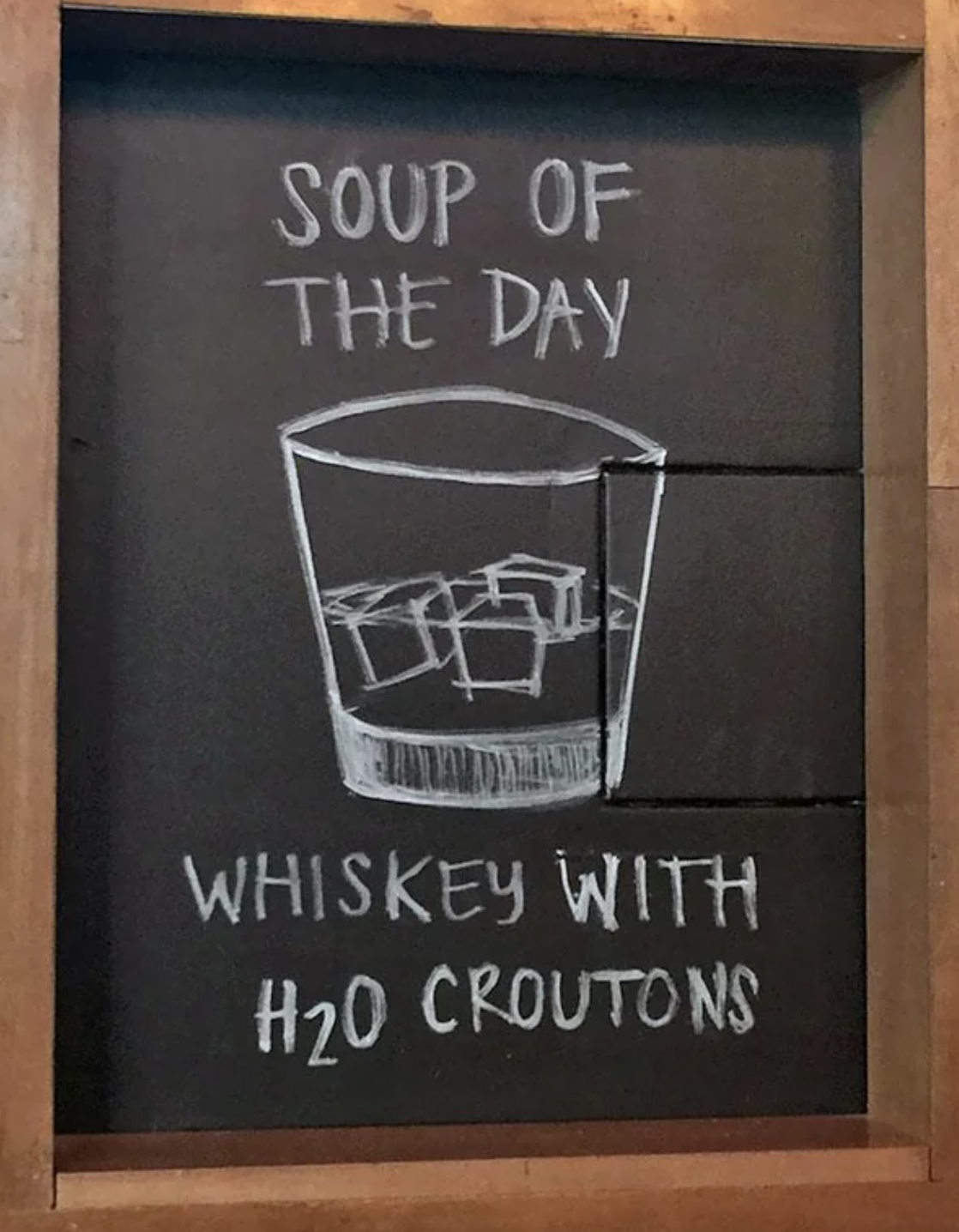 Handwritten restaurant sign: &quot;Soup of the day: Whiskey with H20 croutons&quot; with whiskey glass drawn