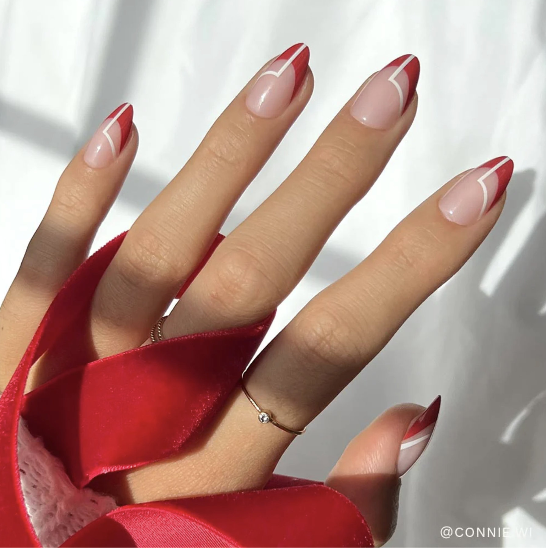 Model wearing red martini nails.