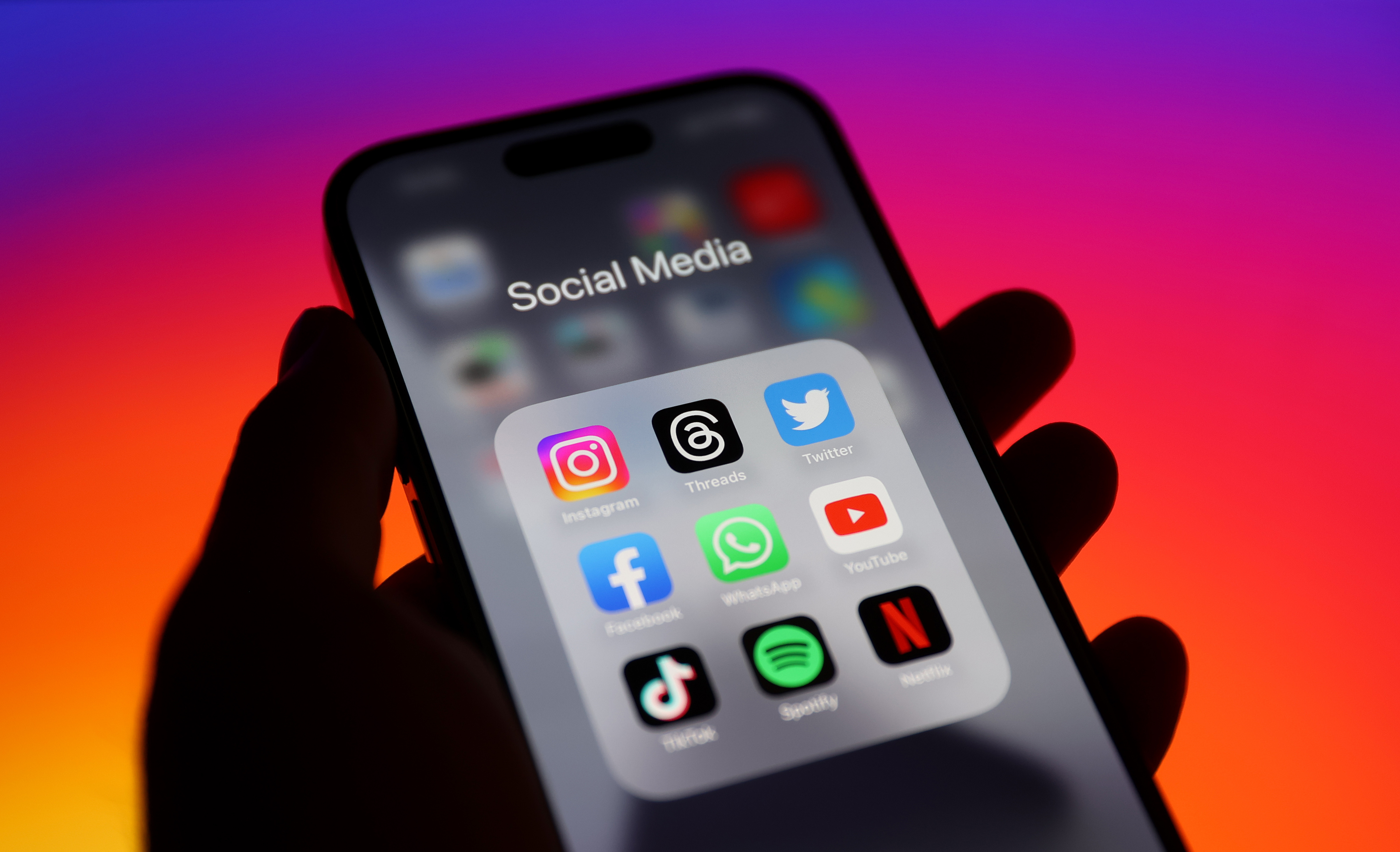 a person&#x27;s phone opened to social media apps