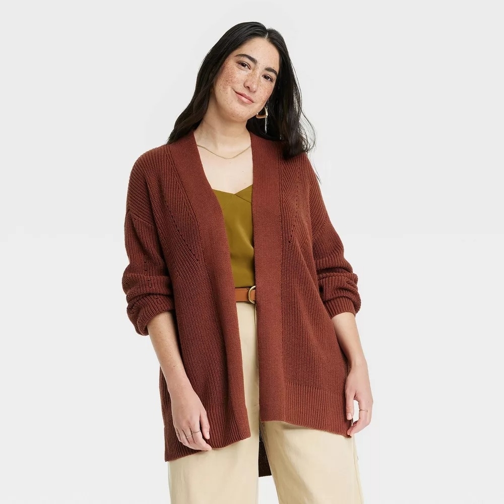 a model wearing the brown cardigan