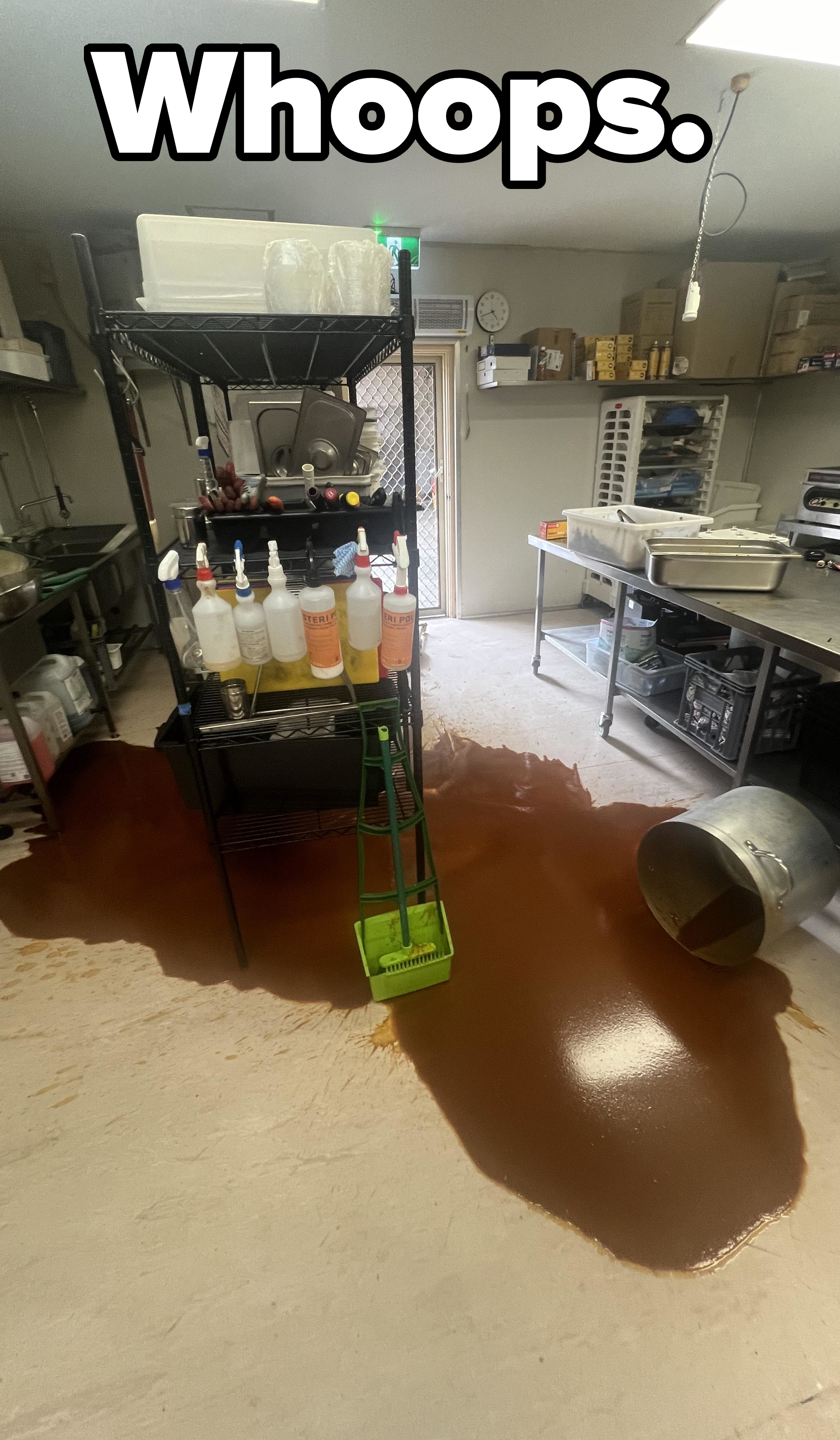A spilled stew or sauce all over a restaurant kitchen floor
