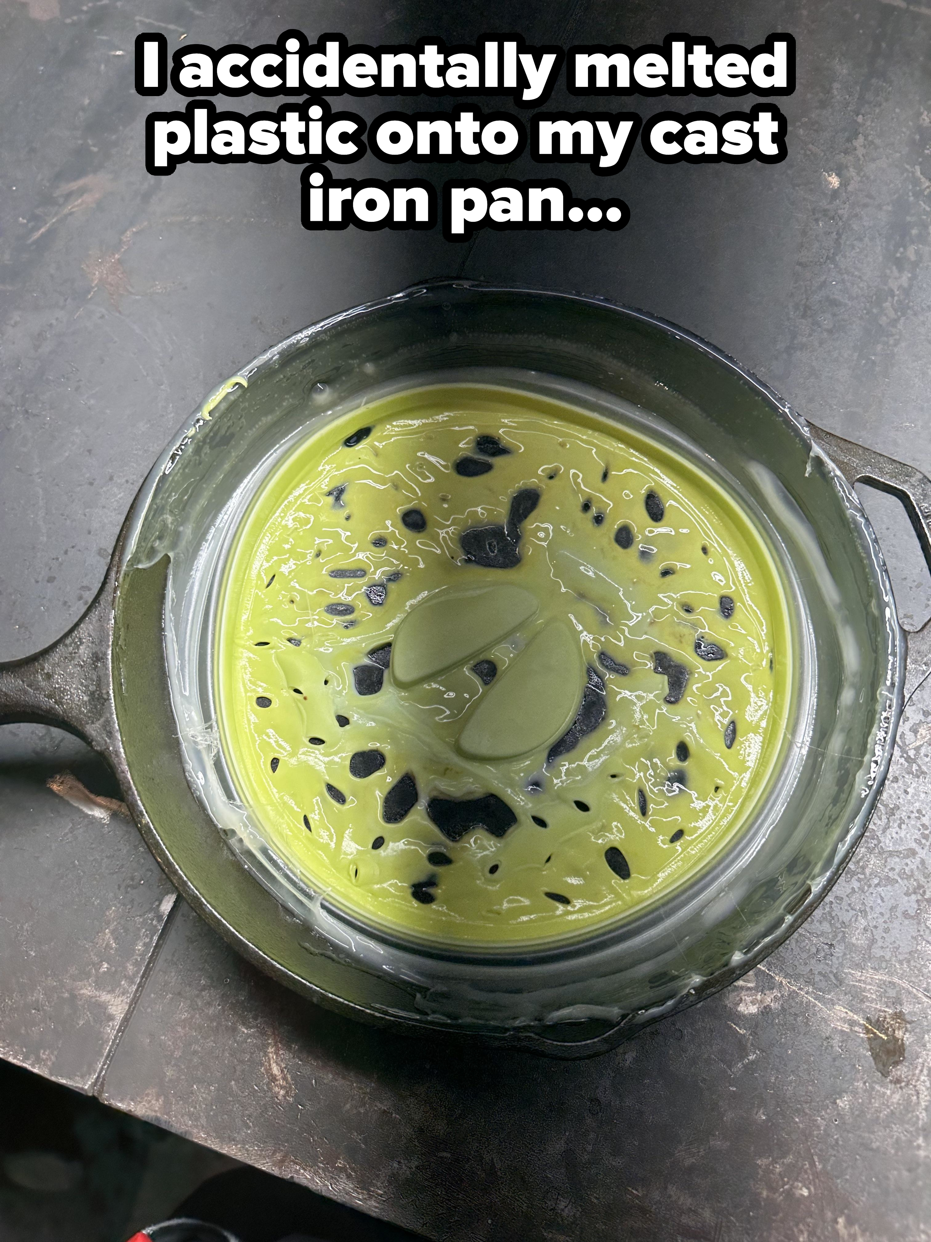 A cast-iron pan with plastic and some liquid melted into it