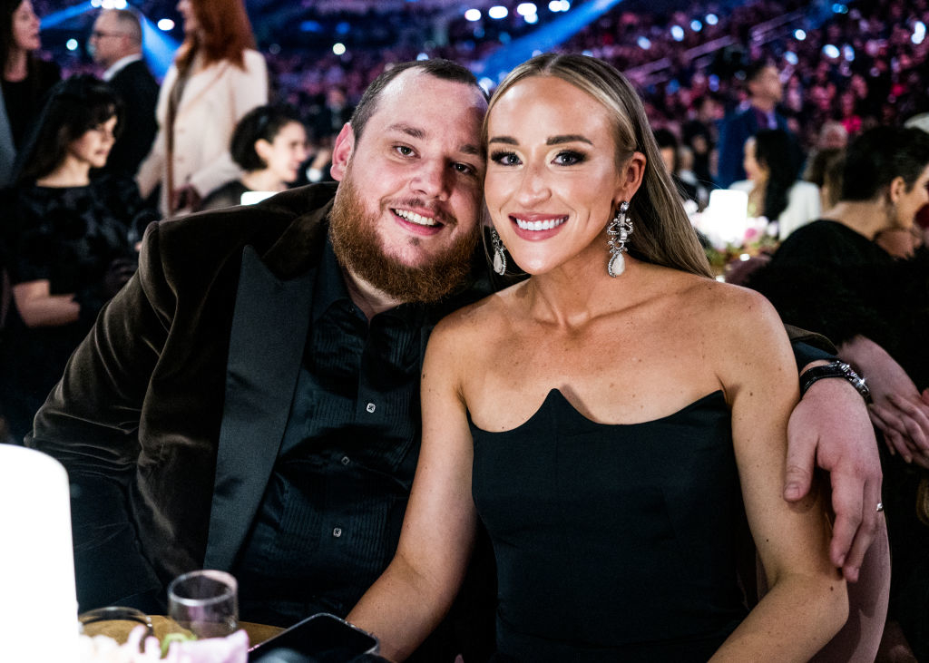 luke and his wife sitting at the event