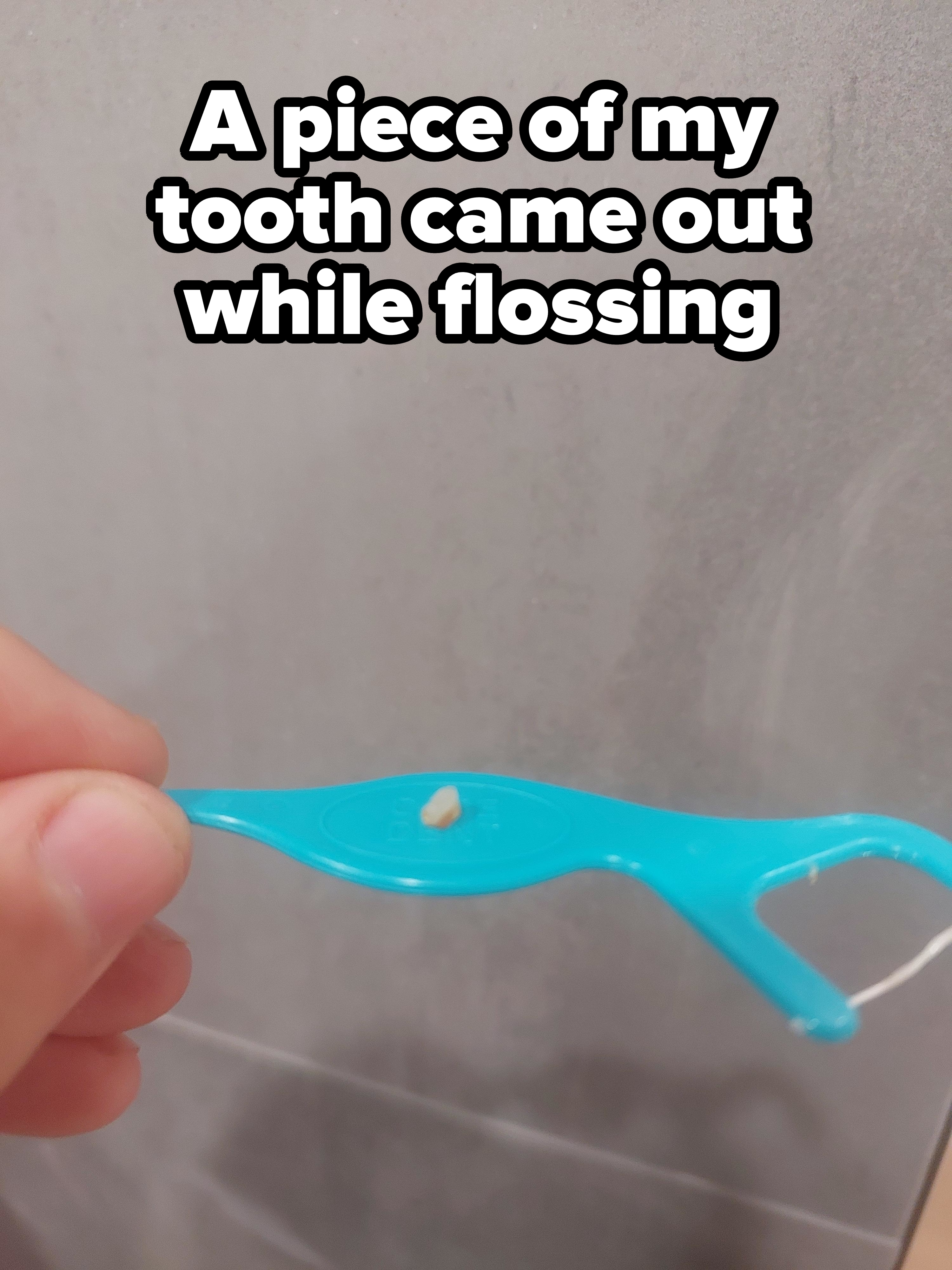 A piece of tooth on a flosser
