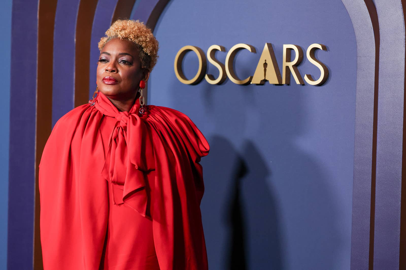 Aunjanue Ellis-Taylor at an Oscars event wearing a cape dress