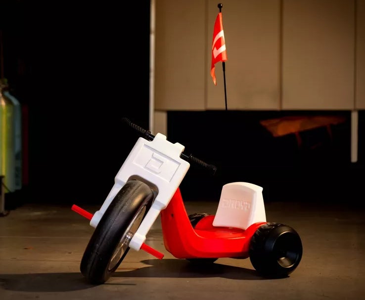 Red and white electric trike with black wheels