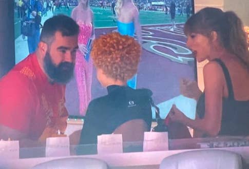 Closeup of Jason Kelce meeting Ice Spice as Taylor Swift looks on