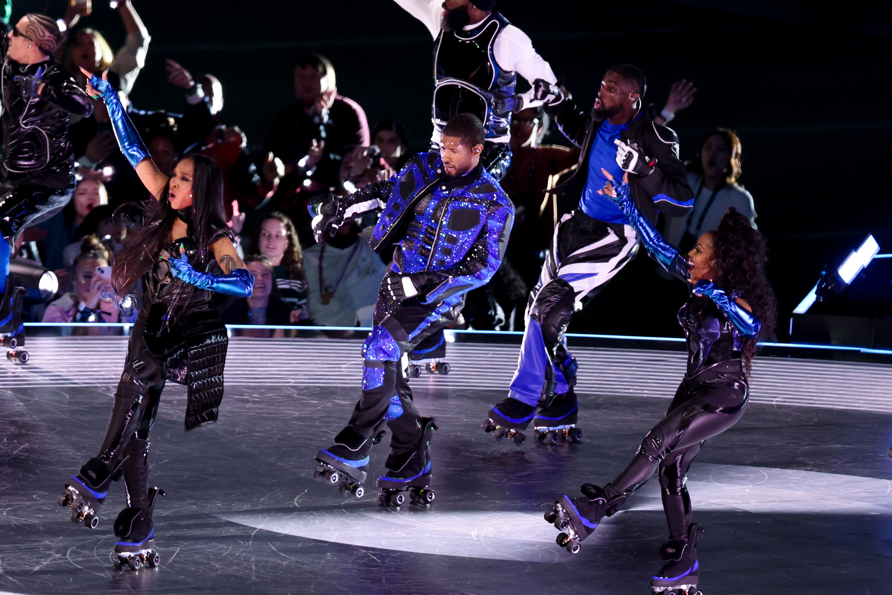Usher roller skating onstage at the Super Bowl
