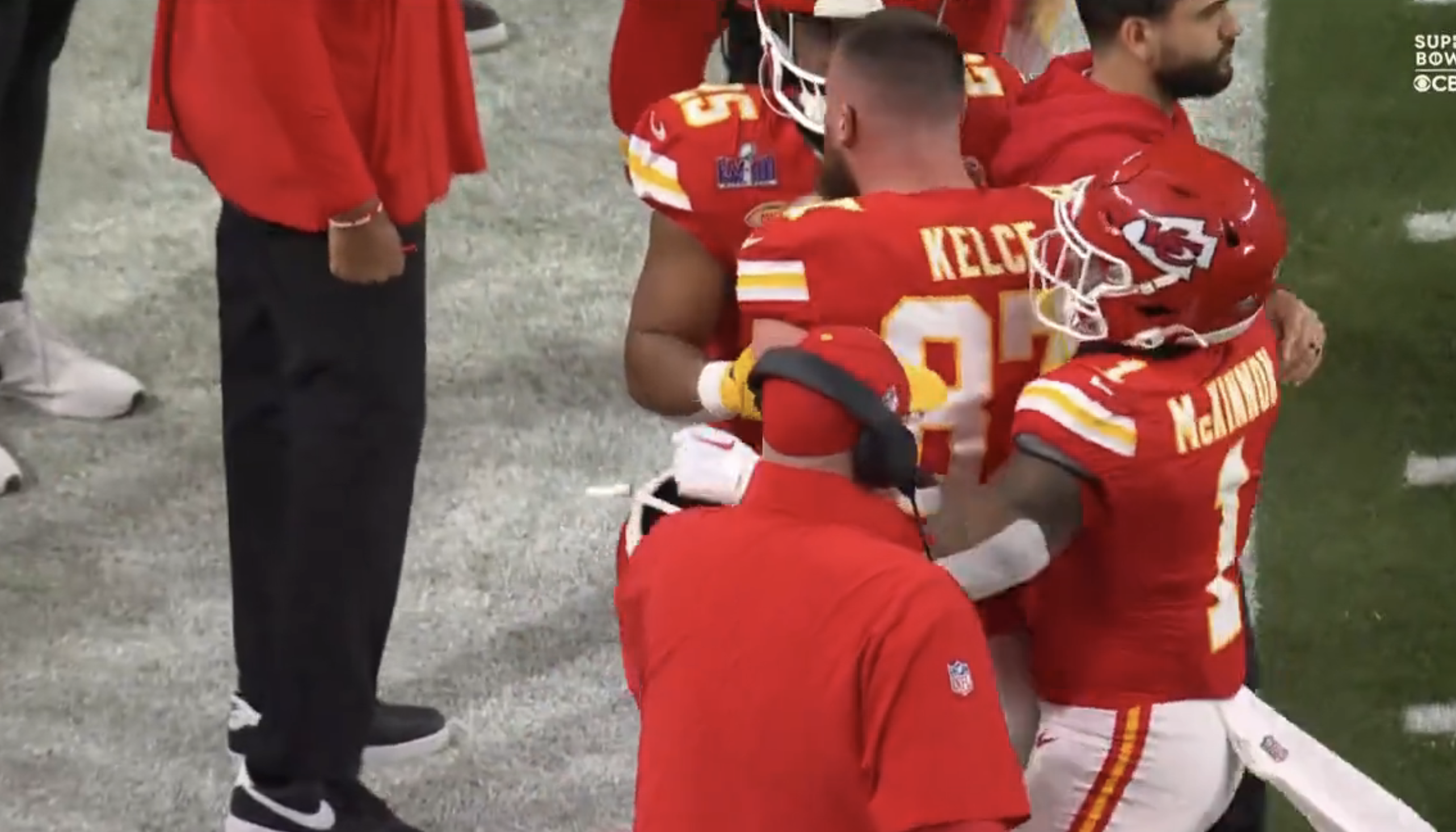 Kelce being restrained by teammates