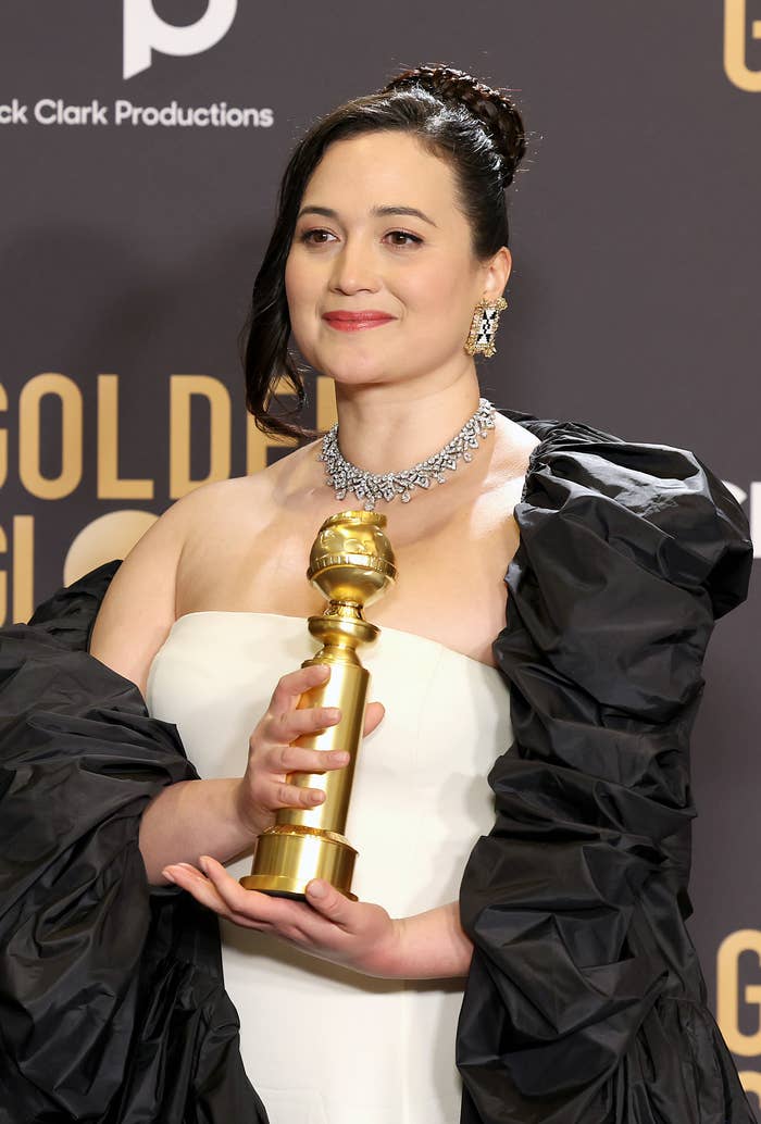 Close-up of Lily holding an award