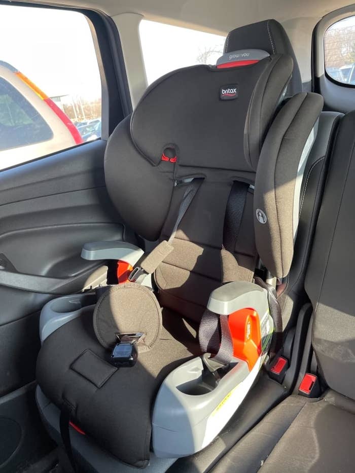 reviewer photo of the booster seat in their car