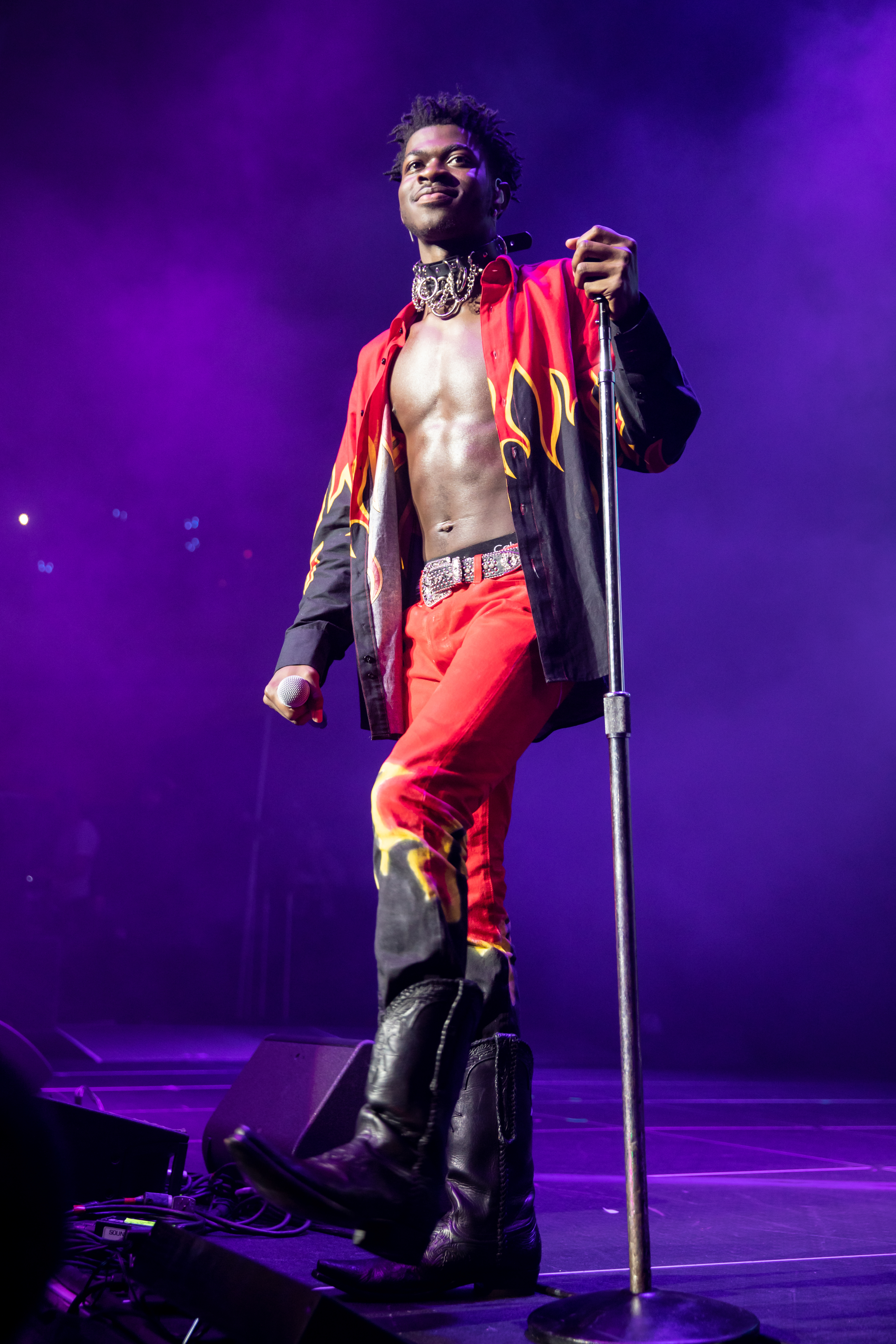 Close-up of Lil Nas performing onstage