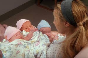Phoebe from Friends holding triplets in a hospital bed