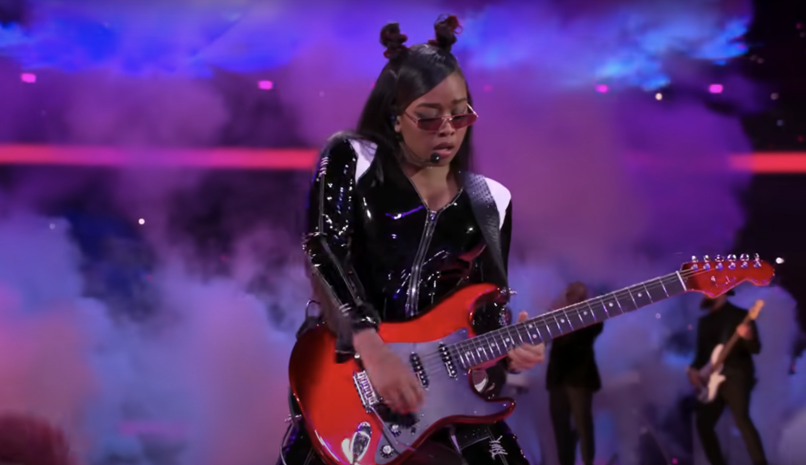 Closeup of H.E.R. onstage at the Super Bowl