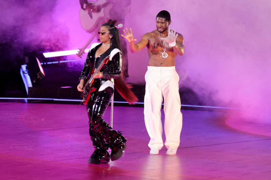 H.E.R. and Usher onstage at the Super Bowl