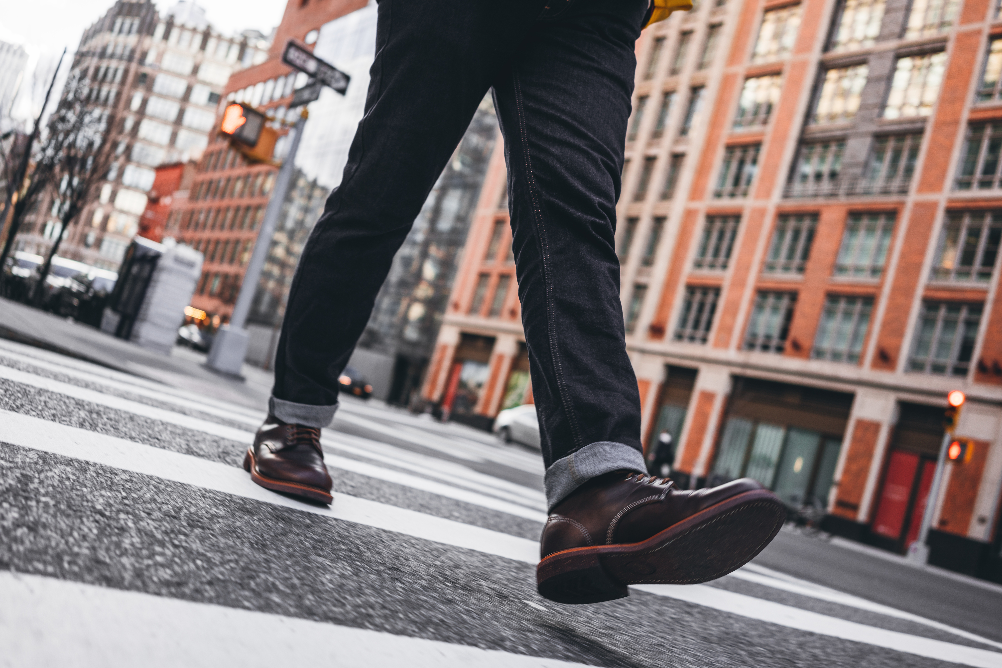 men&#x27;s feet walking down the street