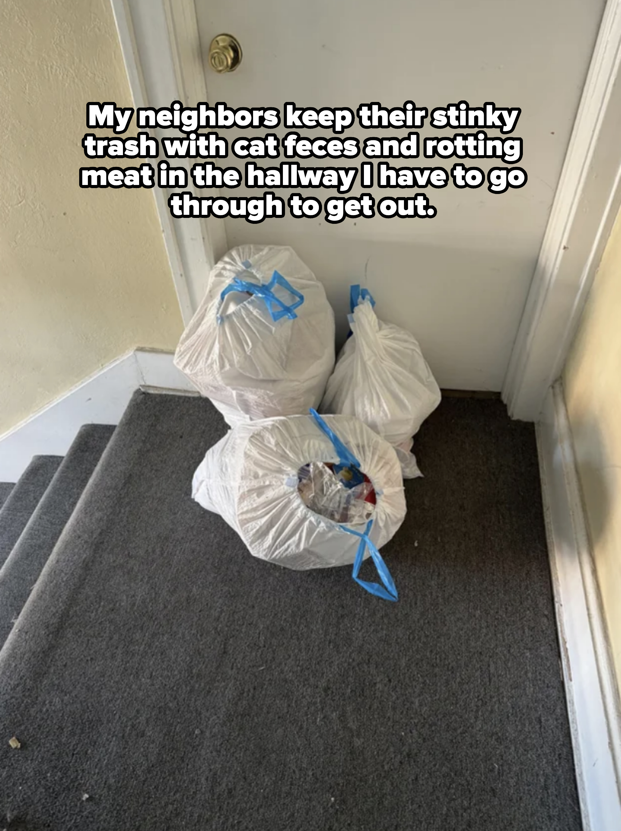 bags of garbage in a hallway