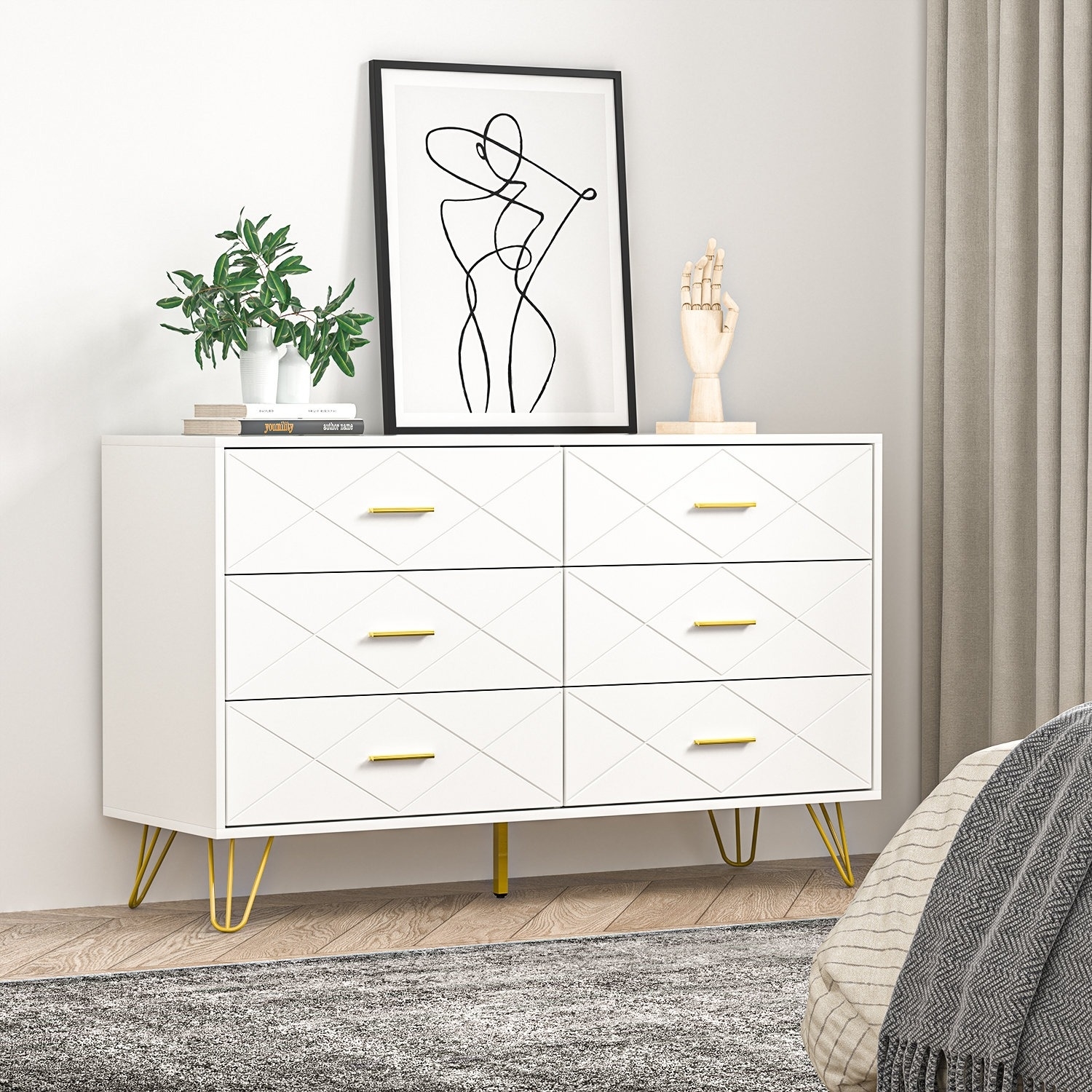 six-drawer white dresser with gold-tone drawer pulls