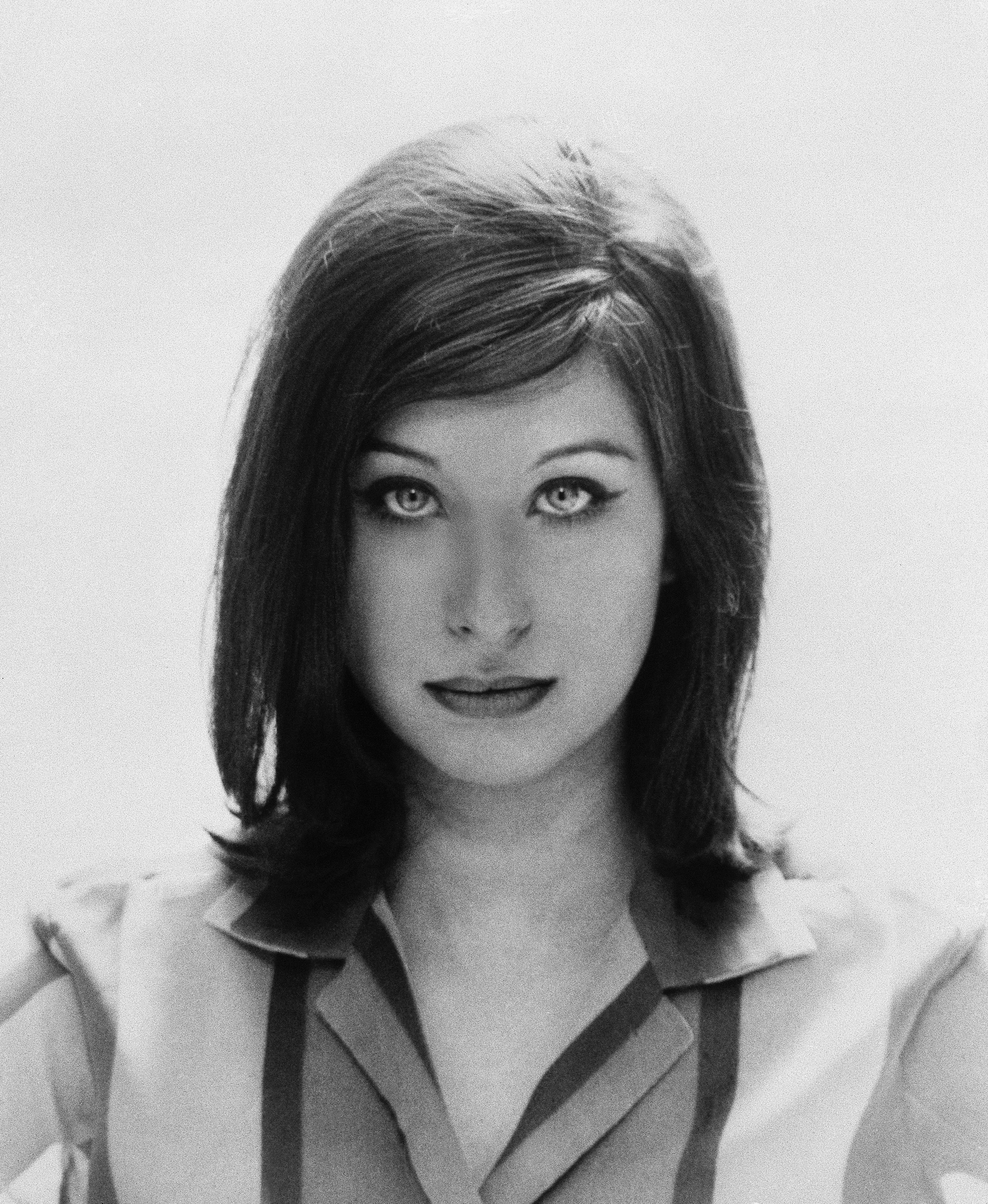 With shoulder-length straight hair
