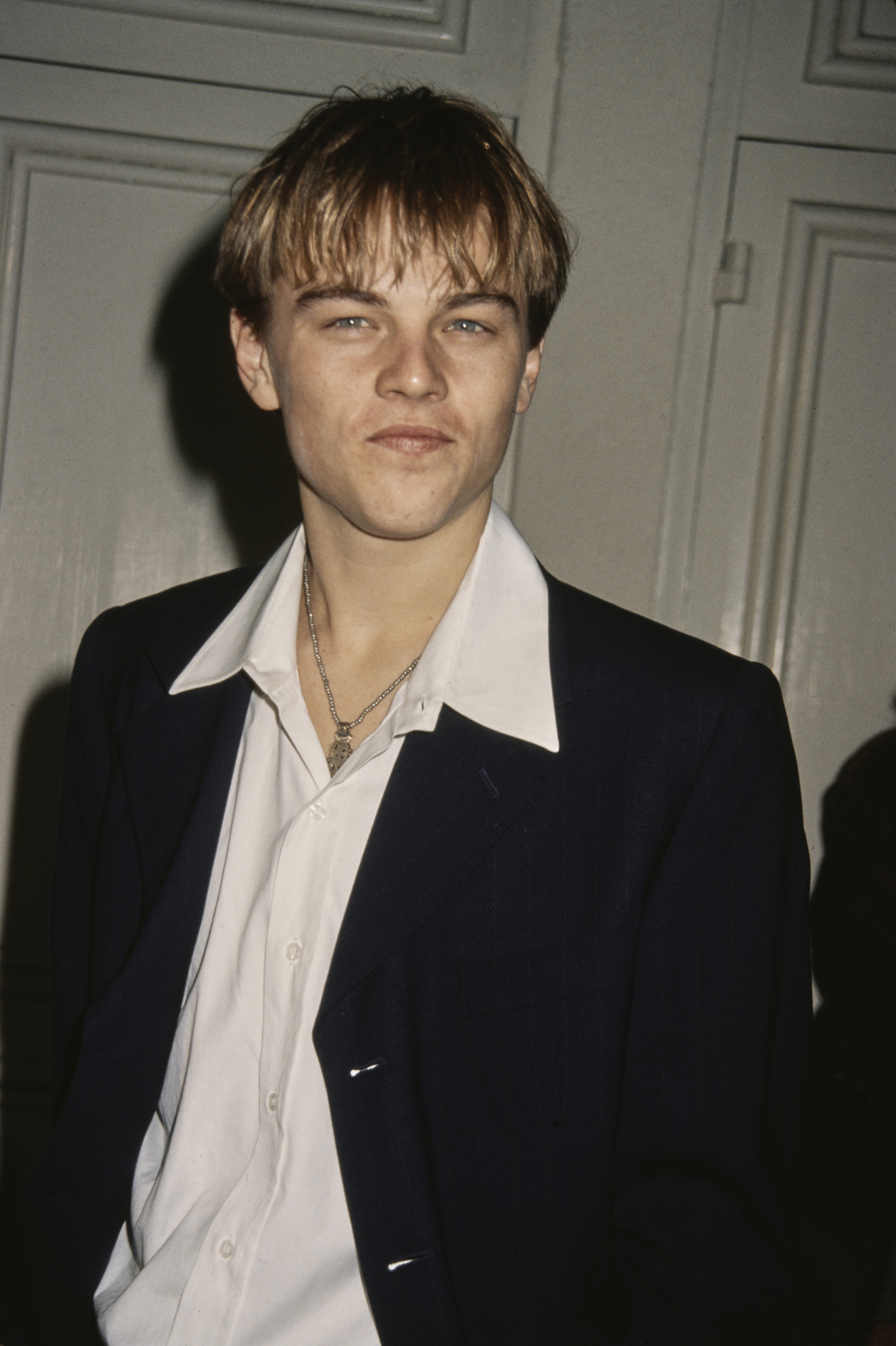 Wearing bangs, a jacket, and a shirt