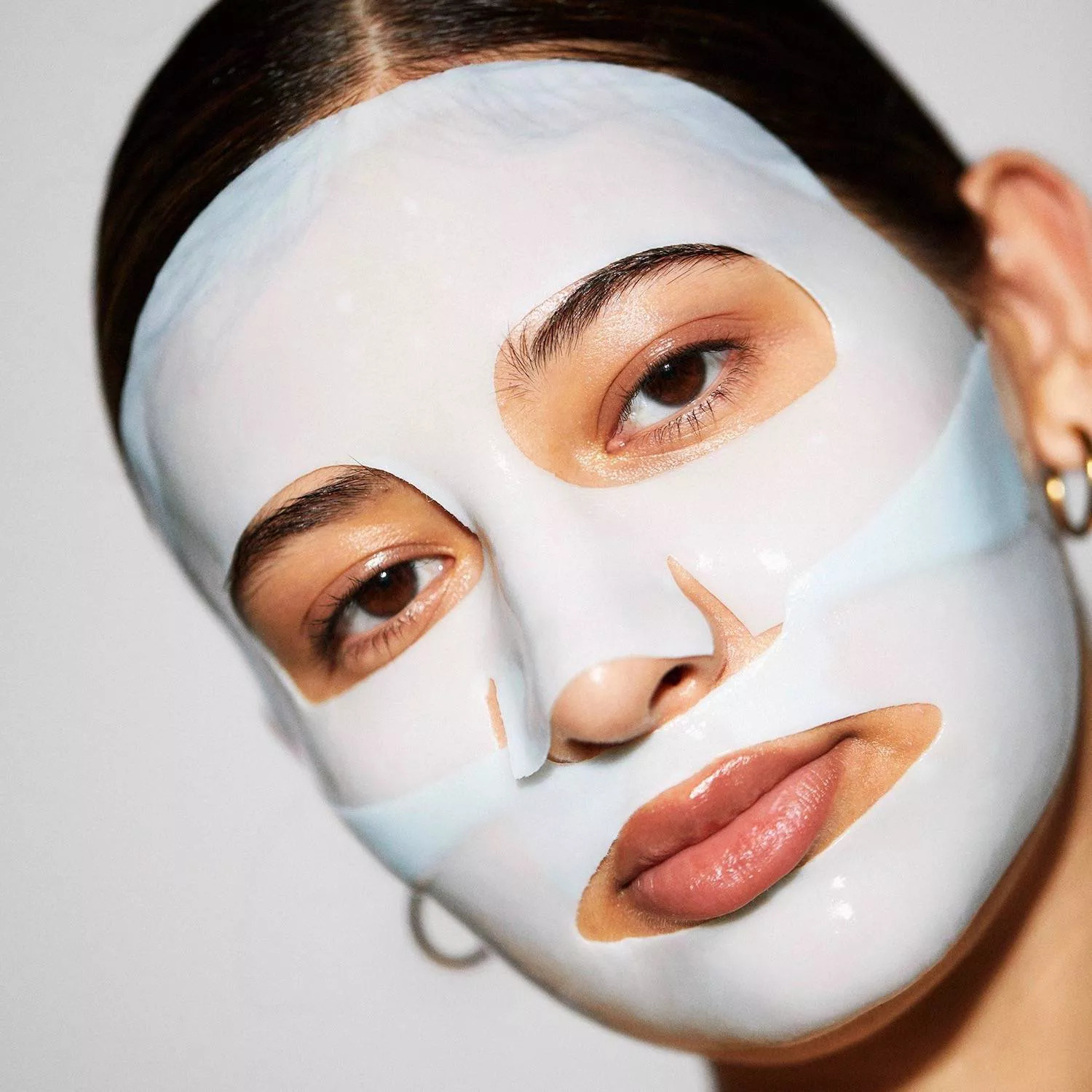 a model with the light blue 2-piece mask applied on their face