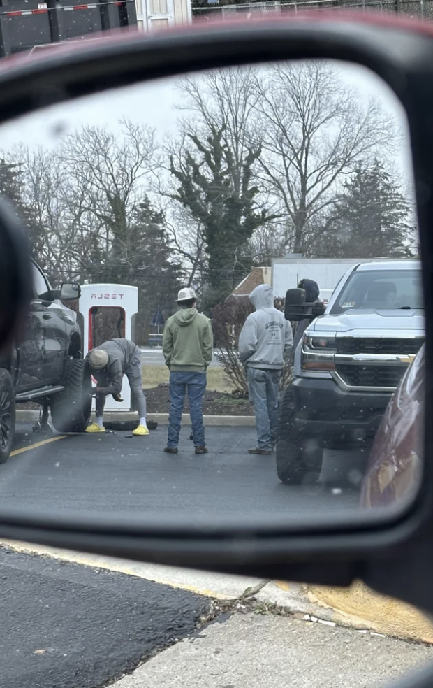 People changing a tire