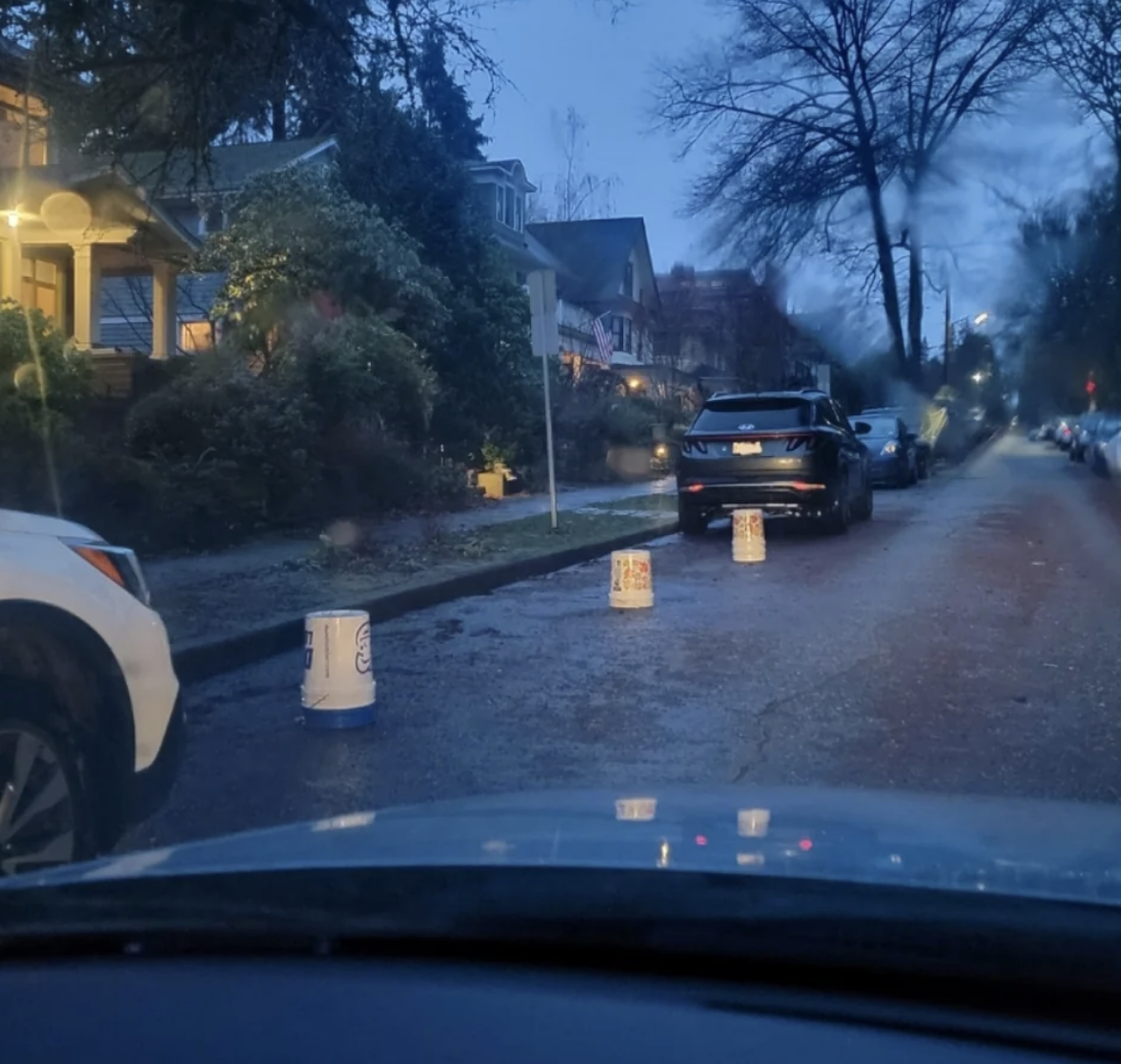 Buckets reserving parking for someone