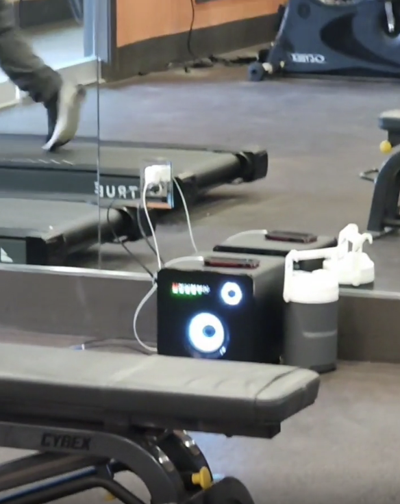 a person using a loud speaker in a gym