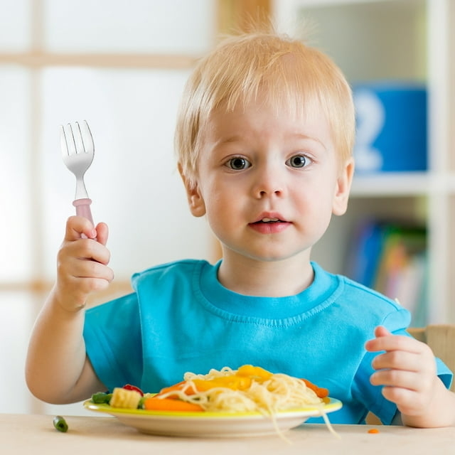 Child eating with fork from set