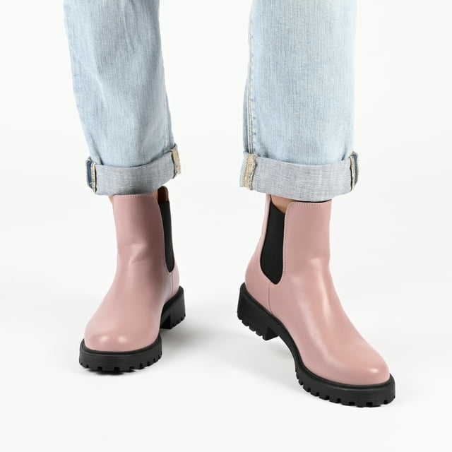 a person wearing the boots in pink