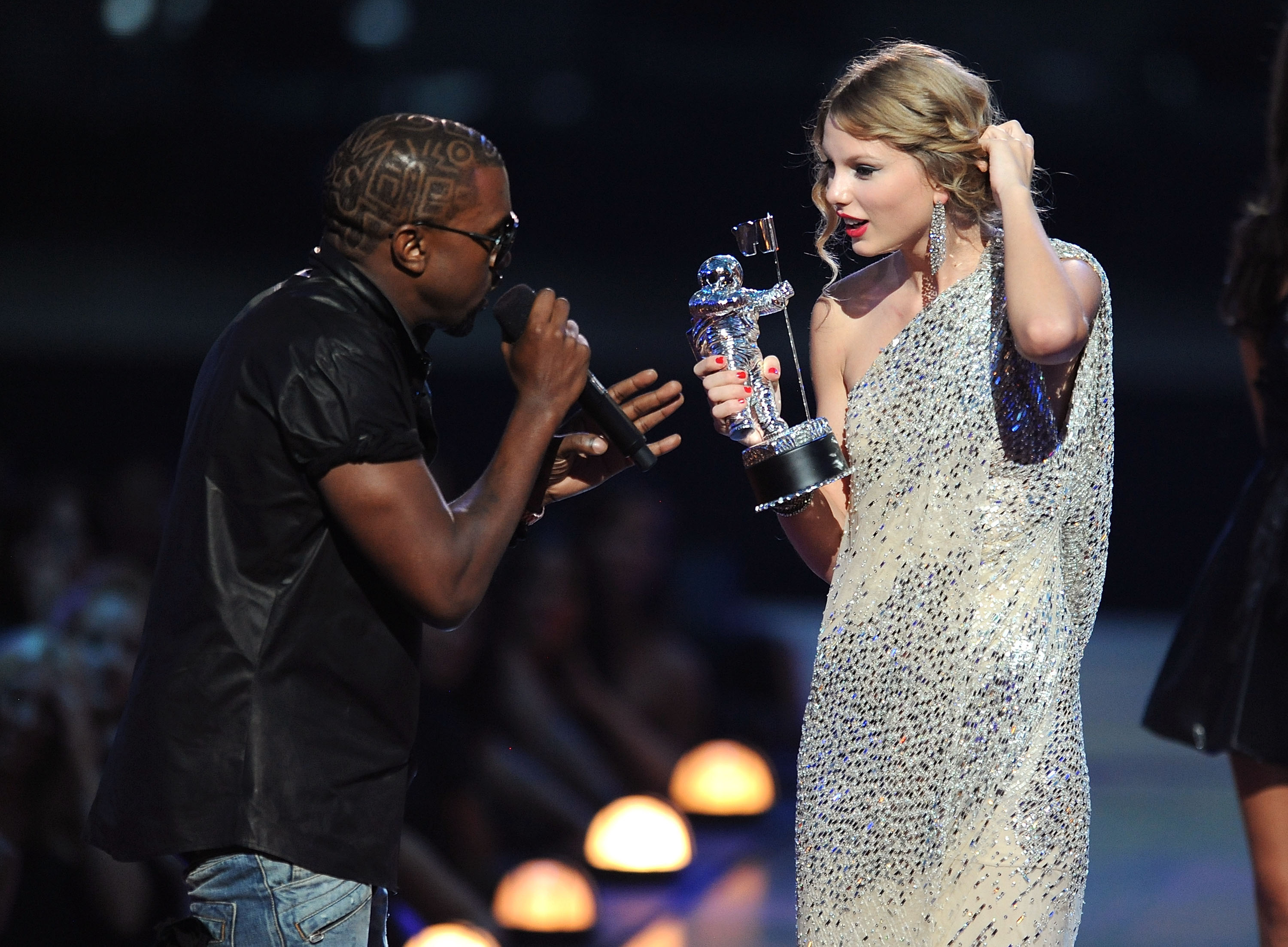 Kanye West interrupting Taylor Swift&#x27;s acceptance speech at the VMAs