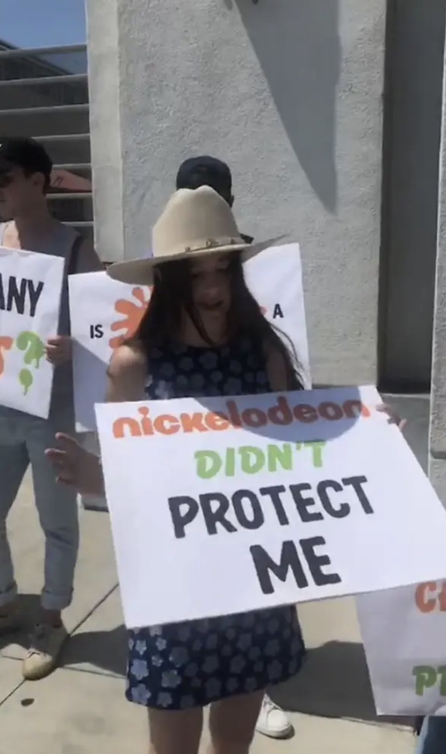 Alexa holding a sign that says &quot;Nickelodeon didn&#x27;t protect me&quot;