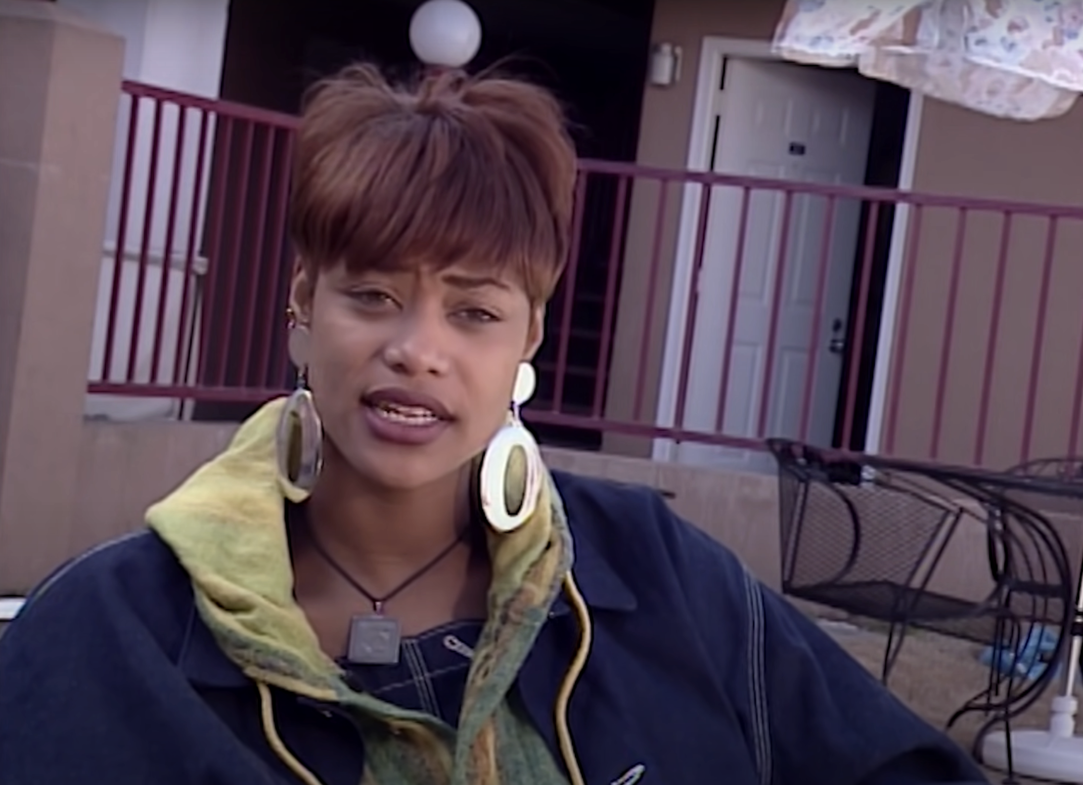 Tami Roman, with big hoop earrings, on The Real World