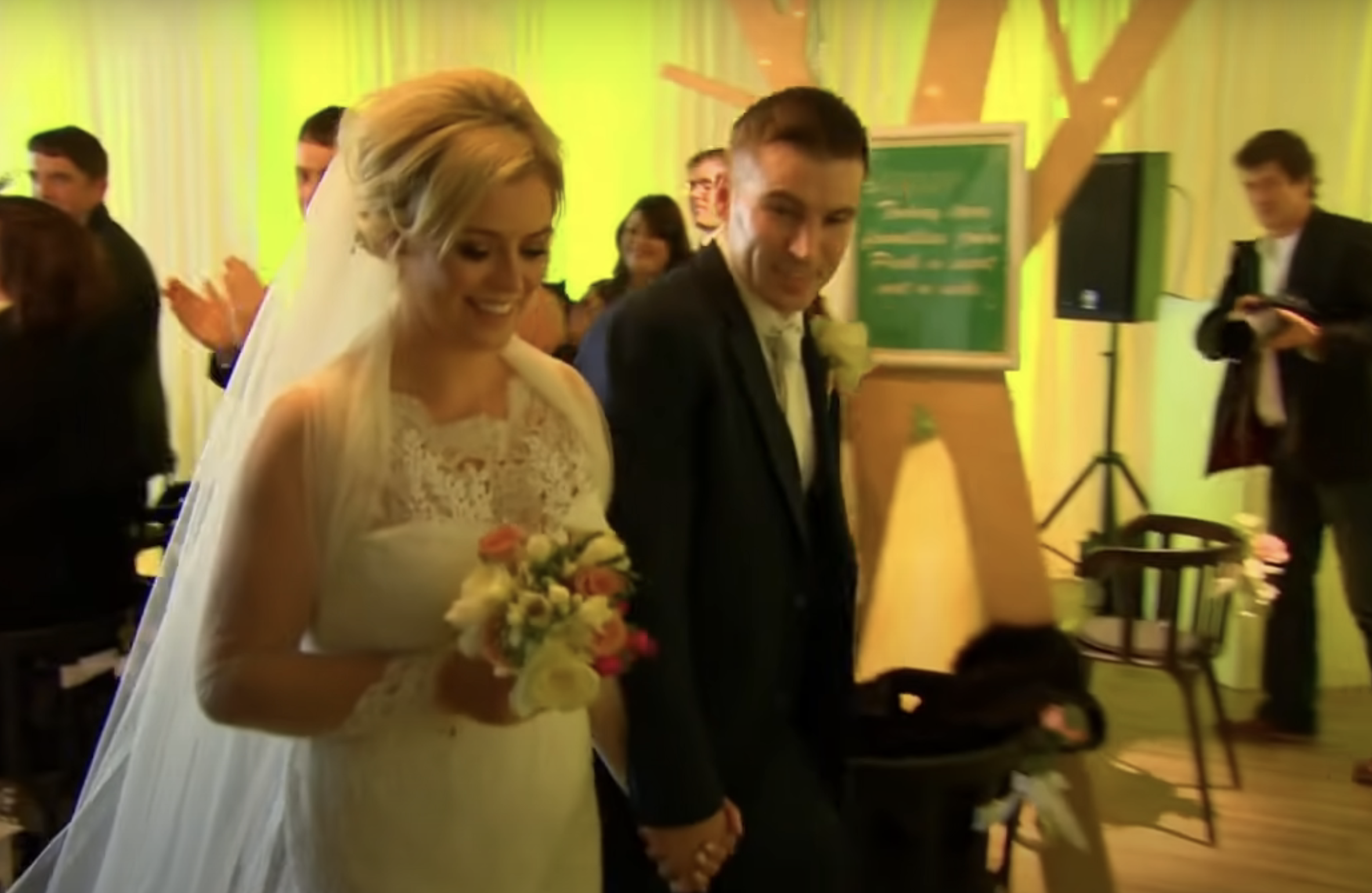 A bride and groom smiling