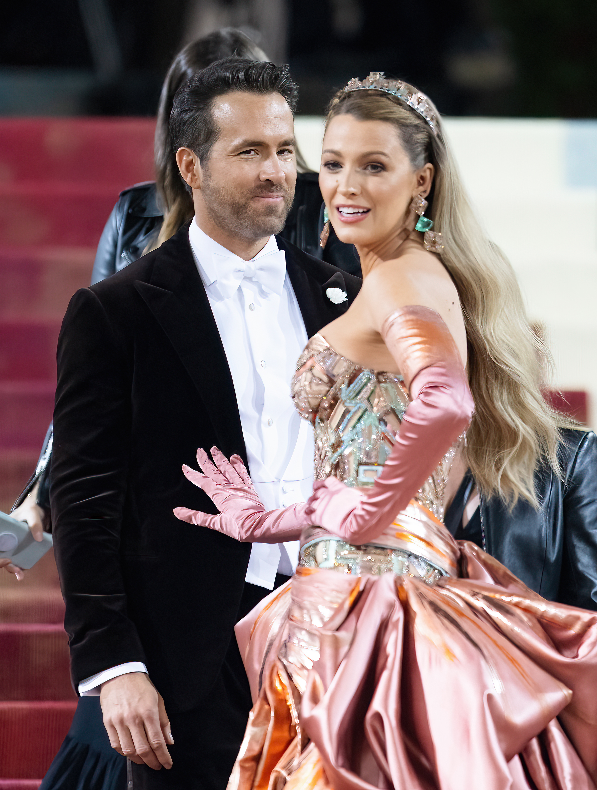 The couple on red carpet, Ryan in a tuxedo and Blake in ornate gown with tiara and gloves