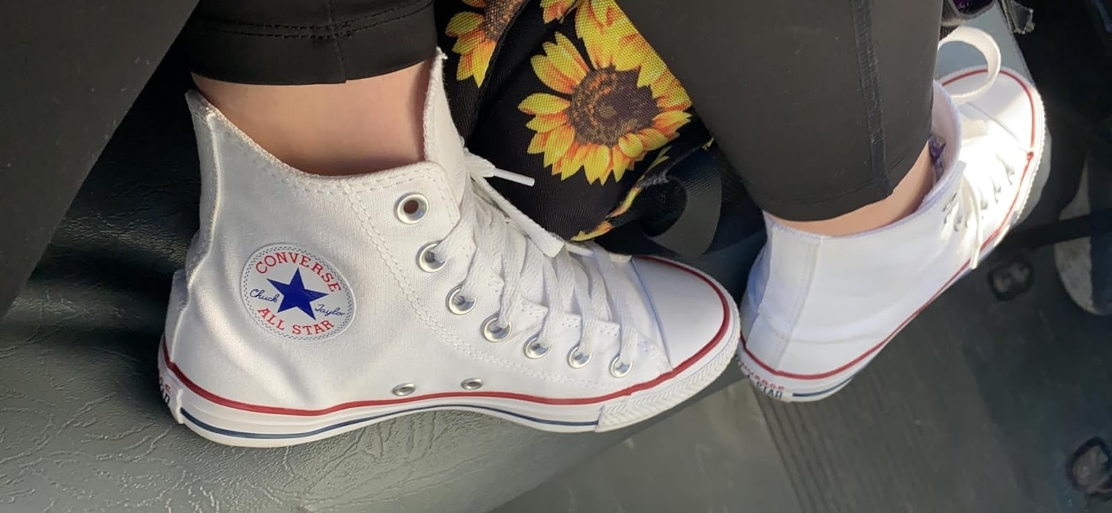 reviewer photo of white high top converse sneakers