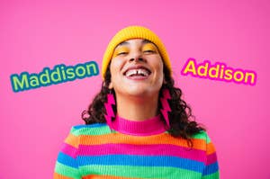 Woman with a gap between her teeth wears a yellow beanie, matching eyeshadow, rainbow striped sweater, and lightning-shaped earrings. Around her head float the names MADDISON and ADDISON.