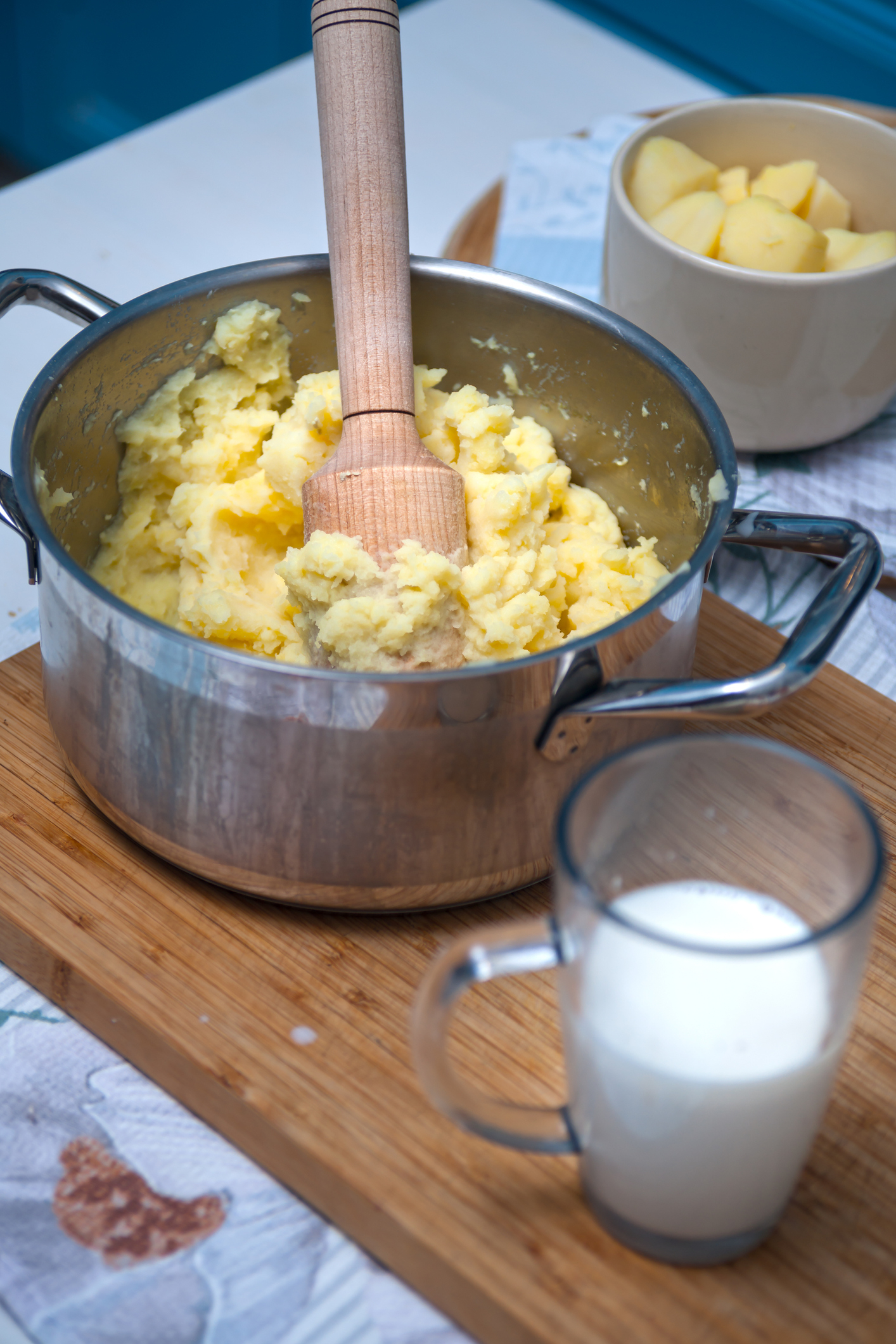 Mashing potatoes in a pot