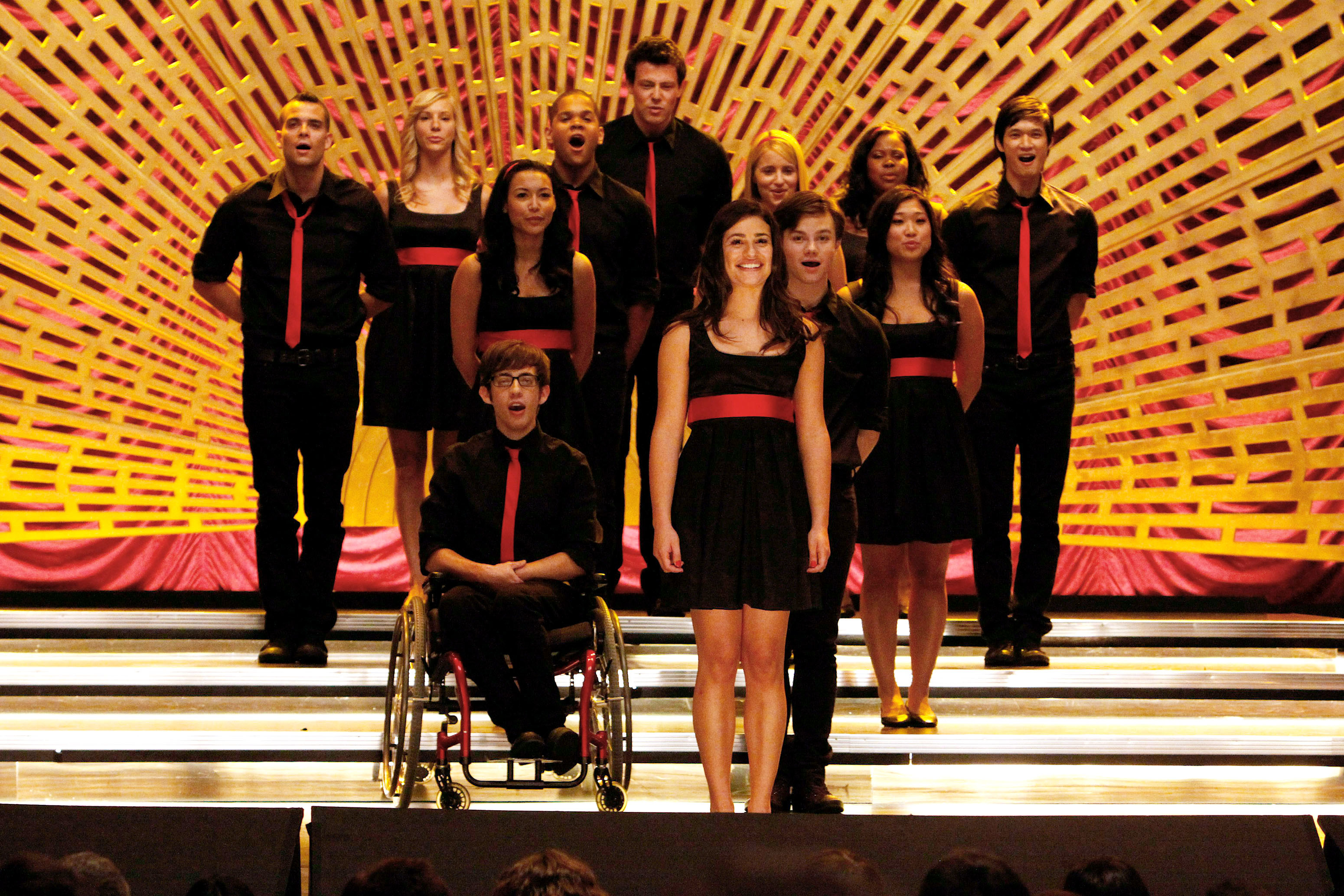 group of teens performing on a stage