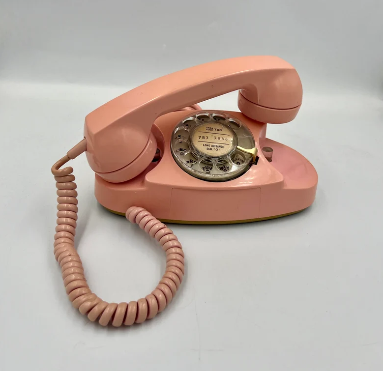 a pink rotary phone