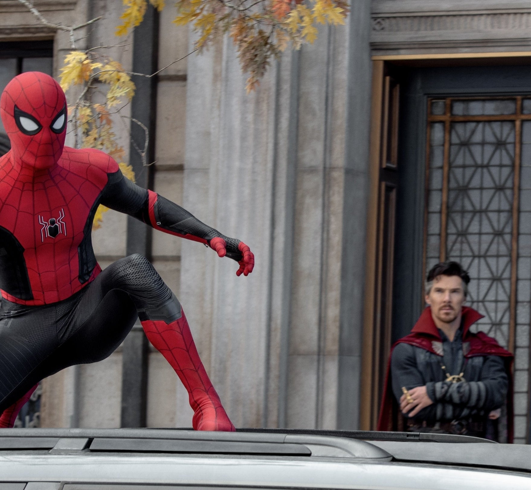 Spider-Man in costume on a car