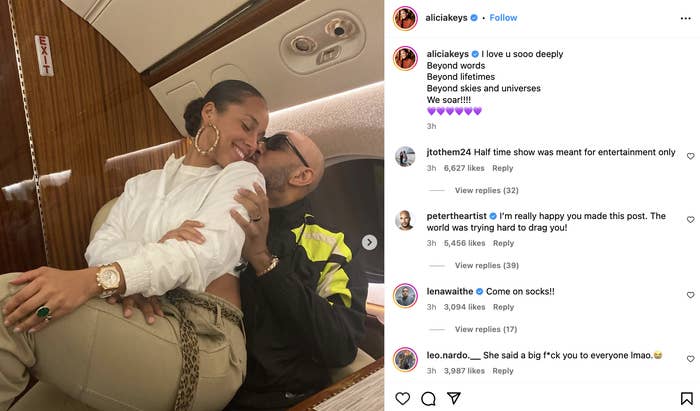 Alicia Keys and Swizz Beatz share a tender moment sitting together, smiling, in a private jet