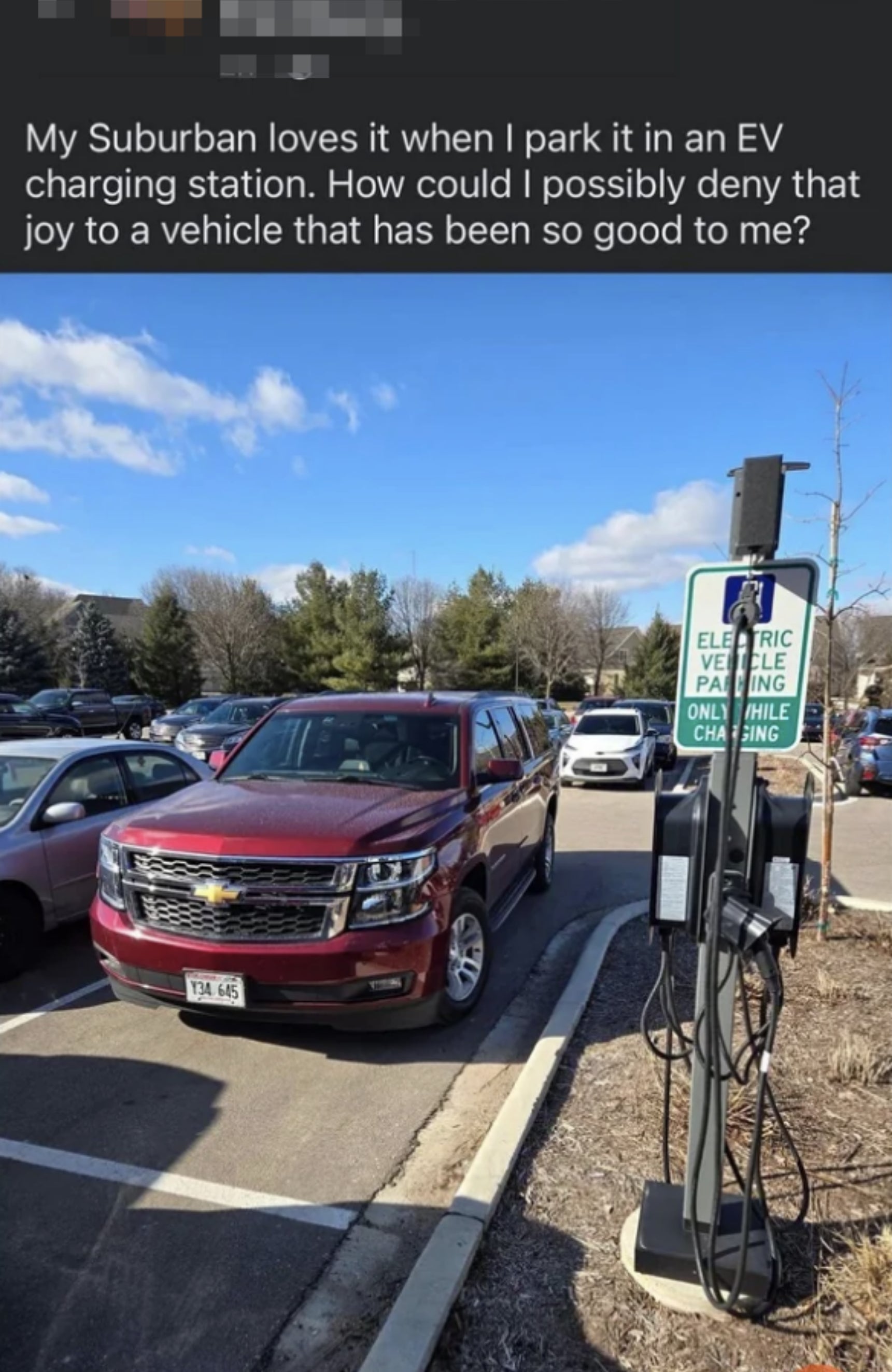 a non-electric car parked near electric charging ports