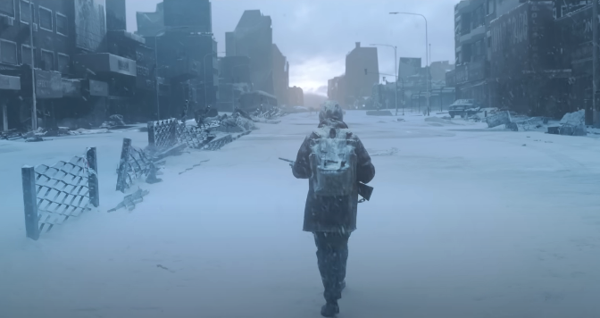 the back of someone as they walk in the snow carrying a rifle