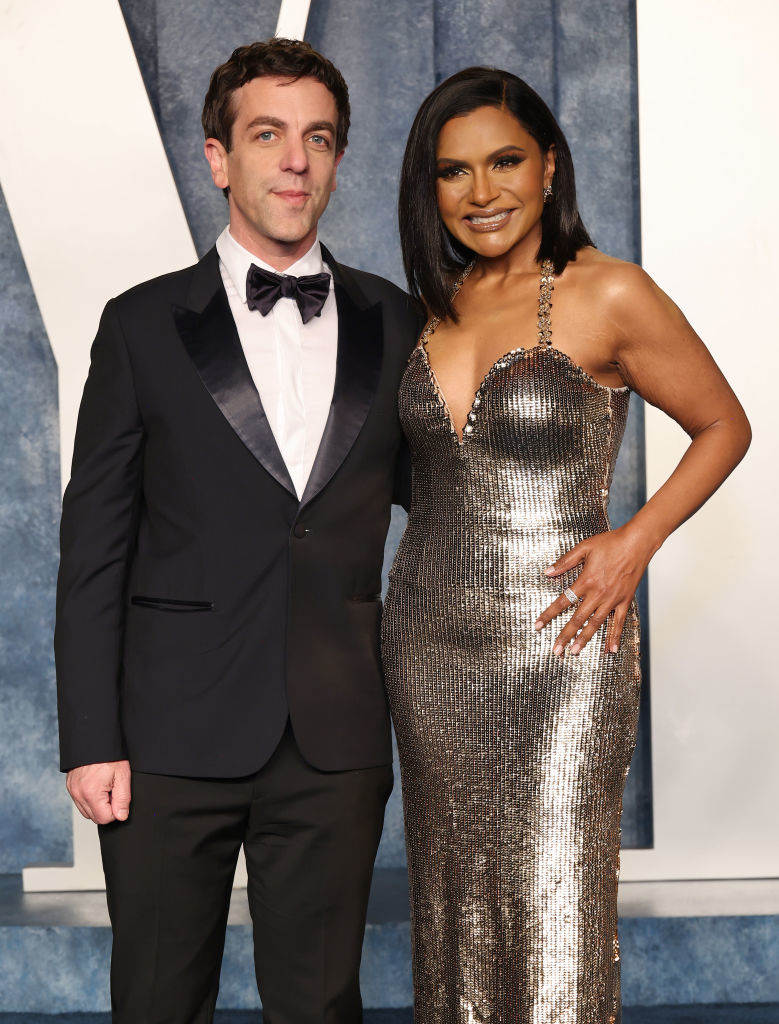 at an event, BJ has his arm around Mindy