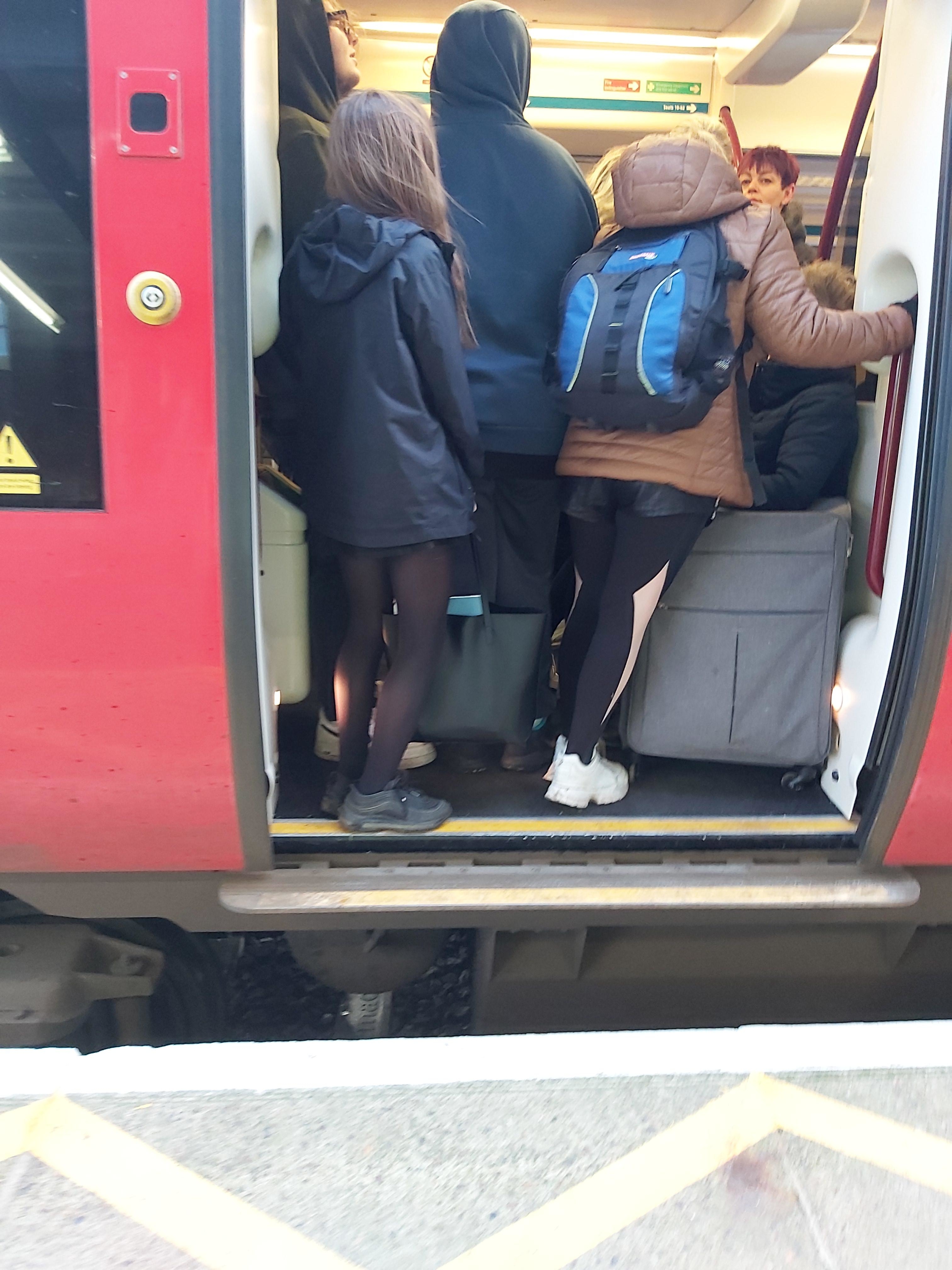 Open door showing a packed train so no other passengers can get on
